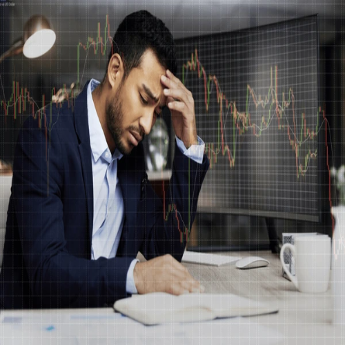 businessman-computer-chart-stress-trading-600nw-2486085261