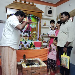 Family participating in Agasthiyar Nadi astrology puja rituals in Madurai.