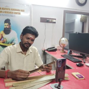Guruji reading palm leaves for Sukshama Nadi astrology during an online consultation